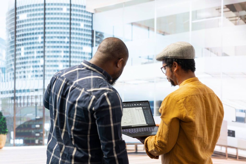 Engineers performing clash detection in BIM using Revit models for project coordination